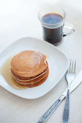 Stack  pancakes with  maple syrup and Cup of coffee
