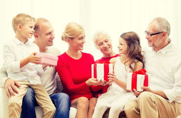 smiling family with gifts at home