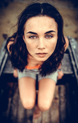 Portrait of young girl outdoor looking up