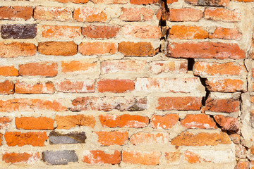 Ancient brick cracked wall