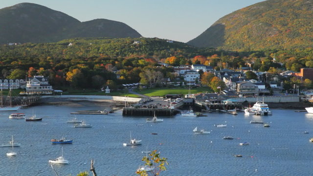 Early morning view of Bar Harbor, Maine and the fall foliage of the surrounding mountains (zoom out from closeup to medium view).