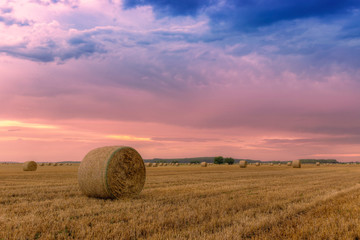 Straw bales with dramatic sky