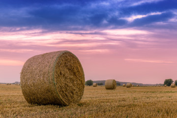 Straw bales with dramatic sky
