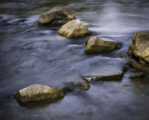 autumn calm river with stones