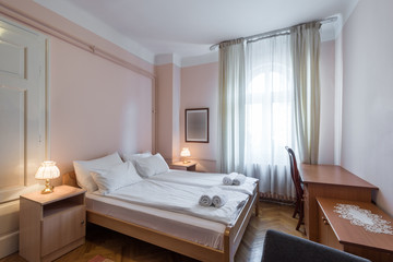 Naklejka na ściany i meble Hotel room interior with double bed