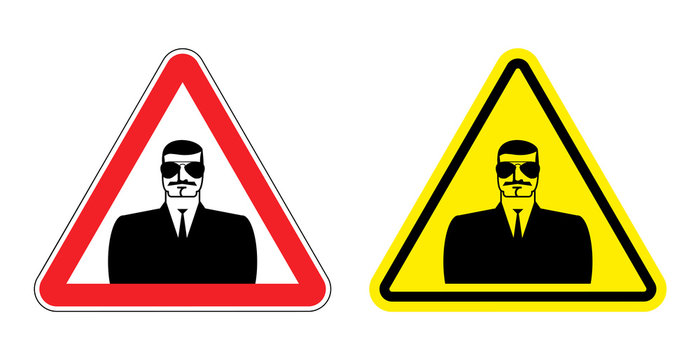 Warning sign of attention to spy. Hazard yellow sign secret agen