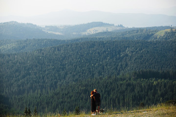 Fototapeta na wymiar Photo of a couple in the mountains
