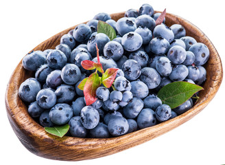 Ripe berries in the wooden bowl.