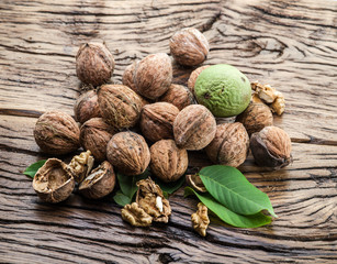 Walnuts on the wooden table.