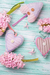 Decorative hearts  and flowers on wooden background