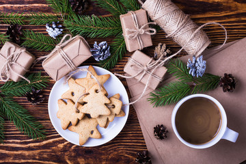 Obraz na płótnie Canvas Xmas holiday background with homemade christmas cookies, cup of coffee