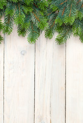 Christmas wooden background with fir tree