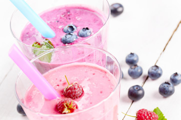 Assorted fruit shakes on white table