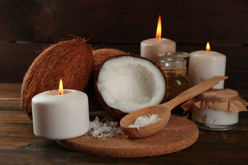 Spa coconut products on dark wooden background