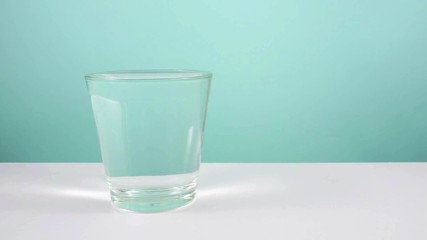 Animation of water filling up an empty glass.