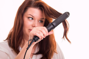 Woman tries to straighten hair