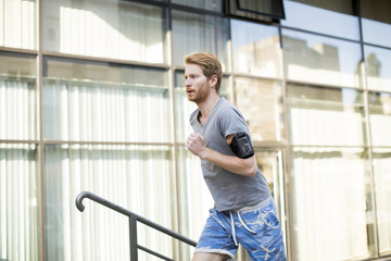 Young man running in the urban area