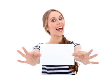 Fototapeta premium Student girl showing white blank sheet - copy space, isolated over background