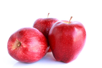 Fresh three red apples isolated on white background.