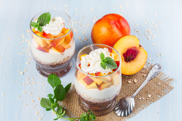 Two servings  yogurt with chia seeds and peach
