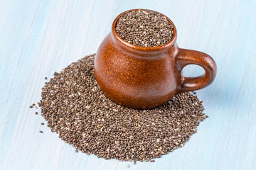 Chia seeds on a blue wooden background