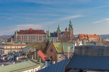Fototapeta na wymiar Royal castle and cathedral on the Wawel hill seen from the Town Hall tower in Krakow, Poland.