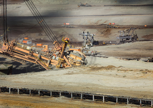 Excavator at the iron ore opencast mining 