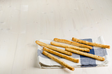 rustic breadsticks  on wood table, close up, background