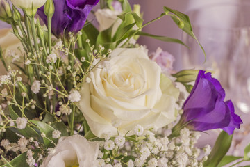 Premium flowers with wonderful white and purple roses. High class arrangement for e.g. a wedding, birthday or business meeting