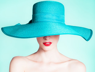 Woman wearing hat. Fashion studio portrait