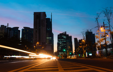 Fototapeta na wymiar Light trails on the street at dusk in Manila, Philippines