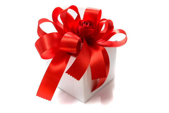 Gift box tied with a red bow.