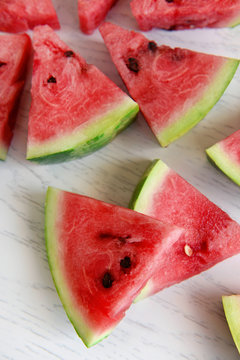 Sliced watermelon on wooden table closeup