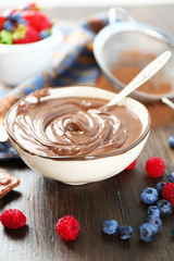 Beautiful composition with chocolate cream and ripe berries