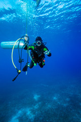 Diver with additional tank, Cuba