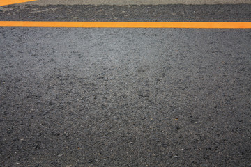 Asphalt road texture background with yellow dashed line