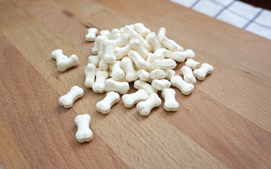 Fototapeta na wymiar Milk pellets in bone shape