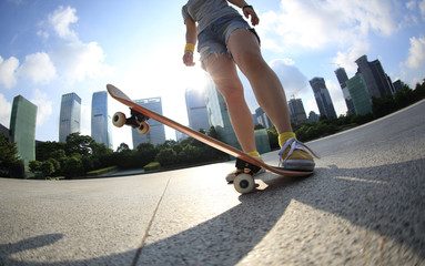 skateboarder skateboarding at sunrise city 