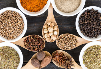 Spices and herbs in  bowls.