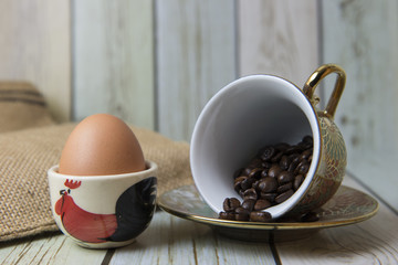 Coffee beans and egg on the table (Still life style)