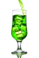 Green alcohol cocktail with splash isolated on white