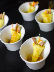 miniature peking duck in crepe with hoisin sauce