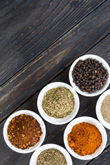 Spices and herbs in  bowls.