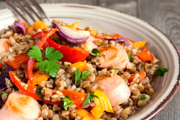 Buckwheat with sausages and vegetables