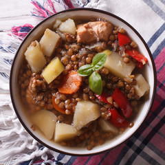 soup of brown lentils with chicken and vegetables. top view 
