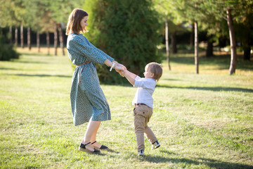 Fototapeta premium Mom playing with son