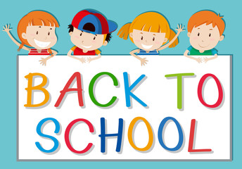 Children holding back to school sign