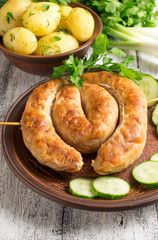 Young boiled potatoes with dill, sausage, cucumber, parsley and