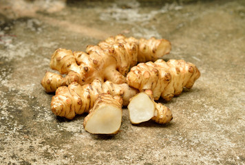 Jerusalem artichoke on  old cement  background