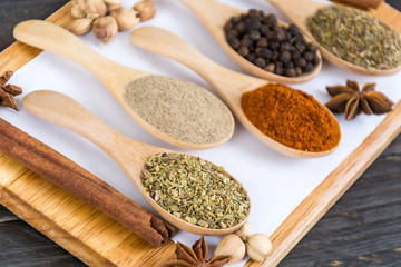 Spices and herbs in  bowls.